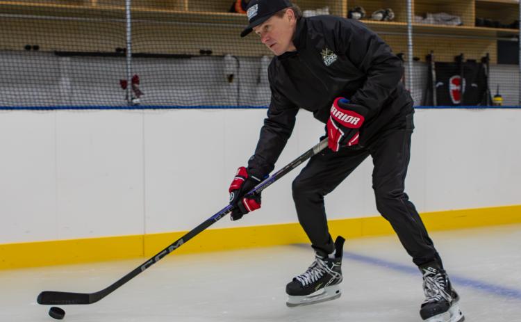 The Sticks Ice Arena owner Don Whalen skates and stick handles with the puck. Photo by Cannon Crompton/sports@cherokeescout.com