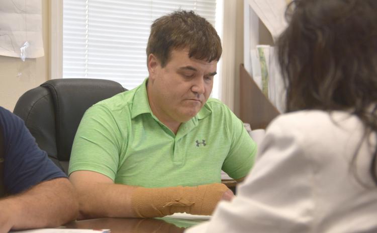 Robbinsville Mayor Shaun Adams, free after posting bond on felony drug charges, presides over Tuesday's regularly scheduled board of aldermen meeting.