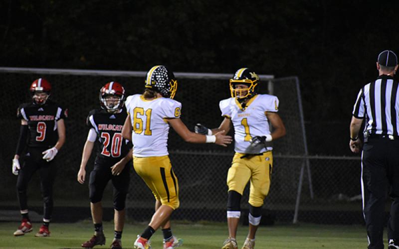 Murphy's Abram Abling (1) and Parker Posey (61) celebrate Abling's first career touchdown in the Bulldogs' win over Andrews. 
