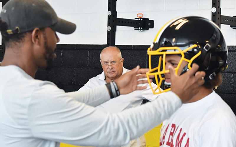 Murphy’s Justice  Dorsey gets fitted for a Zero1 helmet as head coach David Gentry looks on last week. Photo by Noah Shatzer