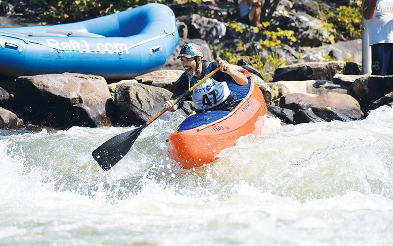 Shawn Malone heads down the Ocoee River across the state line in Tennessee on a test run of the slalom course for the second annual Ocoee River Championships on Friday morning.