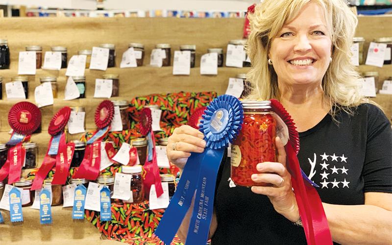 Rachael Linton Ritchie holds her award-winning sliced hot peppers in vinegar at the N.C. Mountain Fair. Photo courtesy of Rachel Linton Ritchie