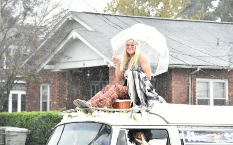 Emma Jones went the hippie route and sat on top of a classic 60s van.