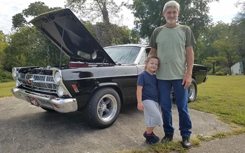 David Johnson and his grandson, almost 4-year-old Connor, are proud to show off Johnson’s 1967 Ford Fairlane during Andrews Cruise Night for the Kids on Saturday night. Johnson said the car will be Connor’s one day.