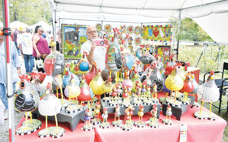 Tim Chambers shows off “Those Kooky Chickens,” his beautiful painted gourds