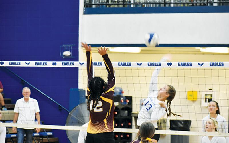 Hiwassee Dam’s Dezeray Adams goes for a spike in the Lady Eagles’ victory against the Cherokee Lady Braves.