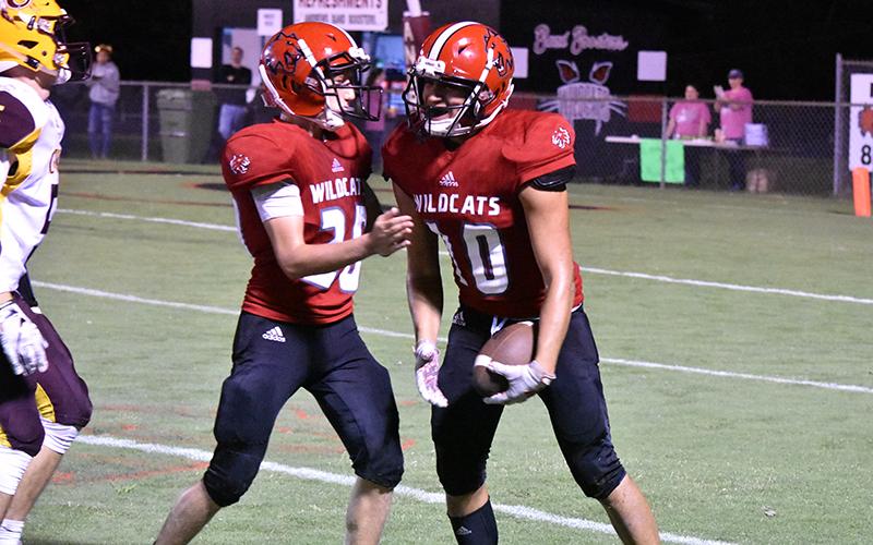 Andrews' Jose Martinez celebrates an interception with teammate Cade Vaughn during Friday's win over Cherokee.