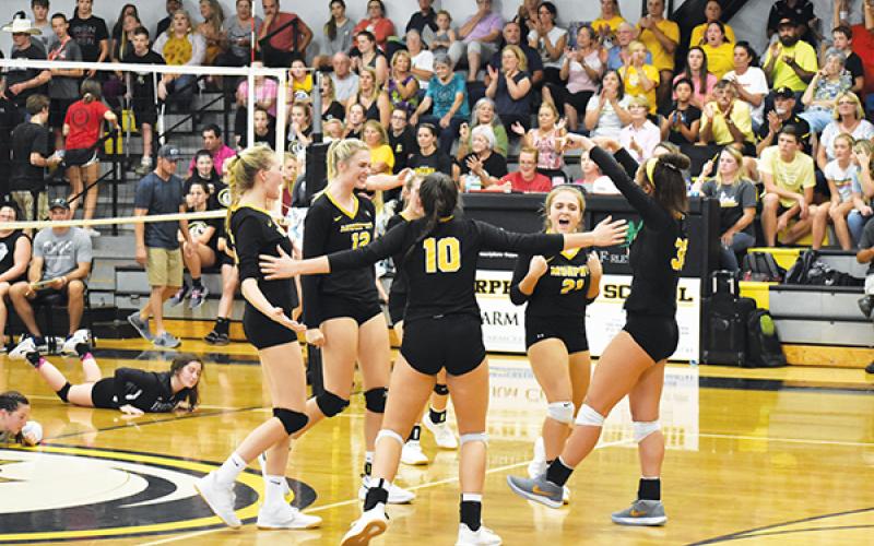 The Lady Bulldogs celebrate a point during their 3-1 victory in Murphy’s rematch against the top-ranked Robbinsville Lady Knights on Oct. 3. Poto by Noah Shatzer