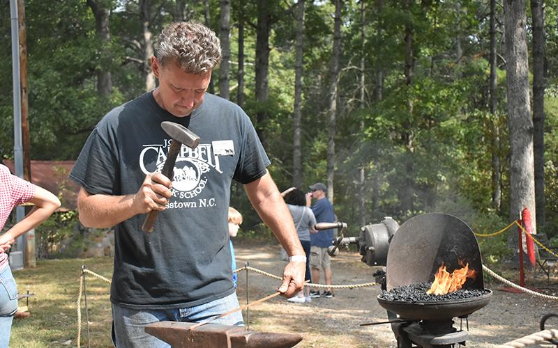 The Folk School's resident blacksmith Paul Garrett showed off his skills to the assembled patrons.