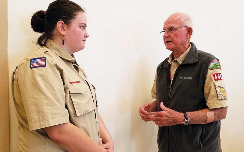 Dave Hotchkiss, charter organization representative for Scouting in Murphy, advises Troop 4400 Scout Cheyenne Griffith during Monday’s veterans tribute at Peachtree Memorial Baptist Church. Photo by Samantha Sinclair/scoutingaround@cherokeescout.com