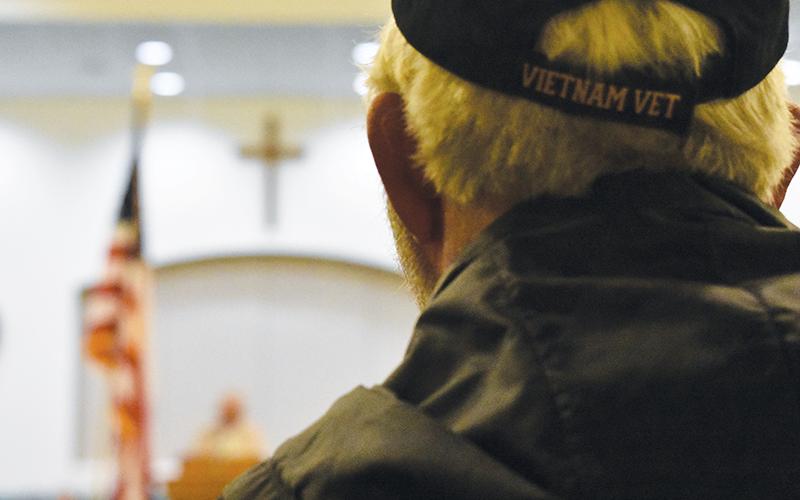 Vietnam War veteran Jeff Crane of Murphy listens to a speaker during the Townson-Rose veterans event at Peachtree Memorial Baptist Church on Monday. Photo by Samantha Sinclair