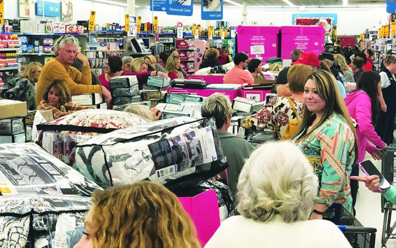 Walmart patrons in Murphy gather around displays of bed and bathroom items before Black Friday sales begin Thursday evening. Photo by Penny Ray