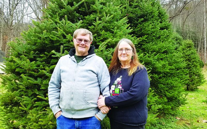 Rick and Judi Postell love welcoming families to their farm and helping them pick out the perfect Christmas tree. Photo by Samantha Sinclair