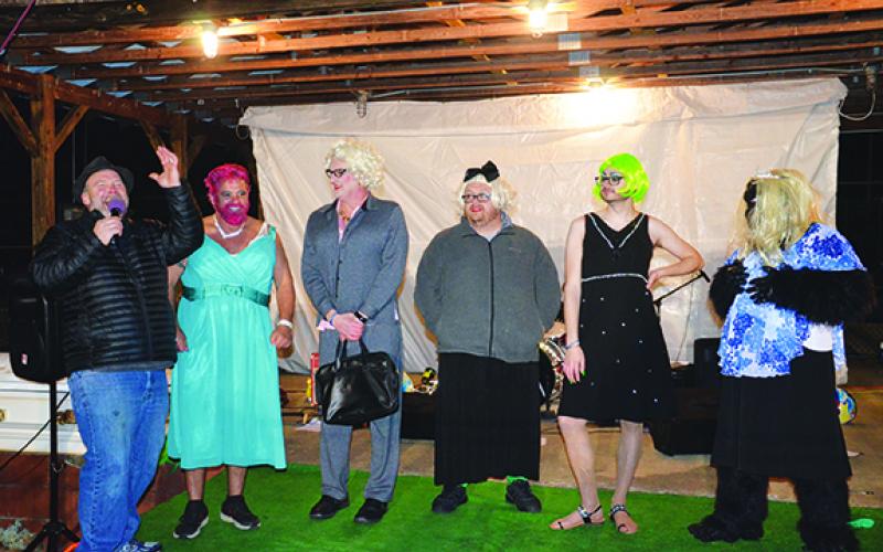 Andrews Mayor James Reid, Andrews Alderman Jonathan Ellison and Tim Radford from WKRK competed in the womanless beauty pageant, which was won by 20-year-old Paris Annas (wearing the green/yellow wig). Photo by Penny Ray 