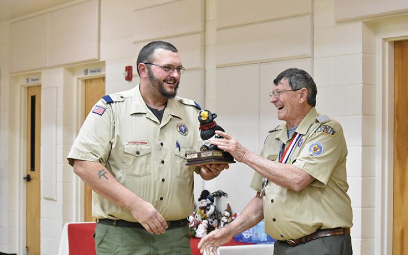 Murphy Cubmaster Josh Frentz accepts the Big Bear trophy from District Chairman Eddie Hollifield. Photo by Samantha Sinclair
