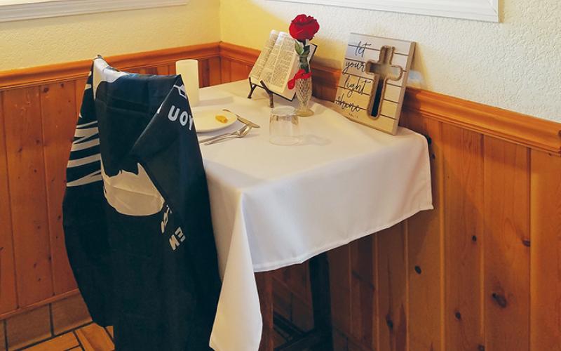 The Missing Man Table at Grandpa Charlie’s County Cookin’ in Andrews is fully decorated to honor those it represents. Photo by Samantha Sinclair