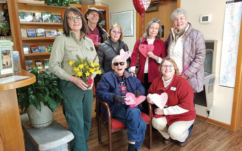 On behalf of the U.S. Forest Service, public affairs officer Cathy Dowd accepted valentines from Frank Landis, Mary Lightner, Lorraine Bennett, Mary Jo Dent, (seated), Tom Bennett and Callie Moore. Photo by Samantha Sinclair