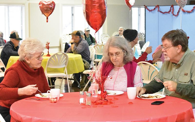 Helen Wilson, Margaret Bolick and James Bolick enjoy a meal together Saturday morning at the Konnaheeta Woman’s Club annual Sweetheart Breakfast. Photo by Samantha Sinclair