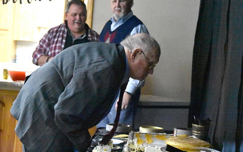 Fred Lunsford blows out the candles on his birthday cake at the party for him Saturday afternoon at Vengeance Creek Baptist Church. Photo by Samantha Sinclair