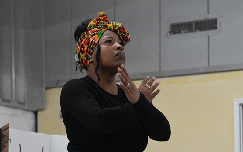 Michelle Lloyd performs to “Glory” during the Artistic Expression Through Black Culture program on March 7. Lloyd said she did some research, but the “spirit of the music” moves her. Photo by Samantha Sinclair