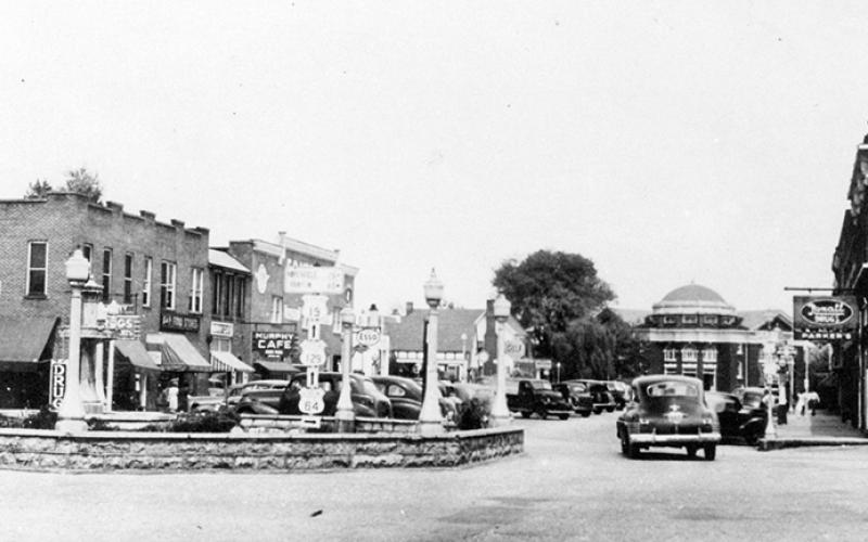 This historical photo shows the Bull Moose Pen and roundabout that existed in the center of downtown Murphy prior to the summer of 1952.