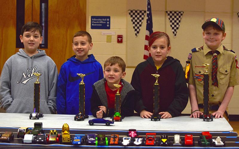 The winners pose with their cars and trophies. Photo by Samantha Sinclair