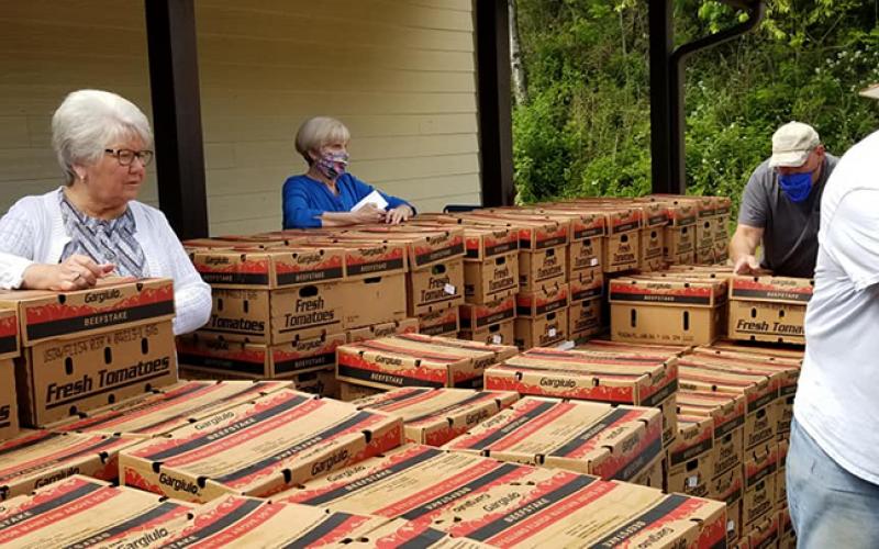 Produce boxes are lined up at the Unaka Community Center on May 21 to be distributed by local volunteers.