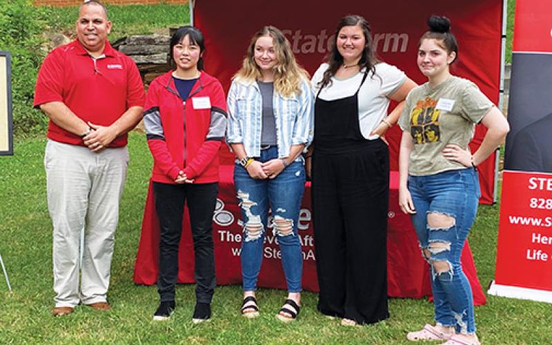 Steven Aft (far left) handed out the annual Extra Mile awards on June 17 at his State Farm Insurance office in Murphy. The Class of 2020 winners include (from left) Ayana Yan of Robbinsville, Isabella Rogers of Hayesville, Journie Newton of Murphy and Victoria Diaz of Andrews. Gracie Ledford of Hiwassee Dam arrived as the event was concluding. Photo by David Brown