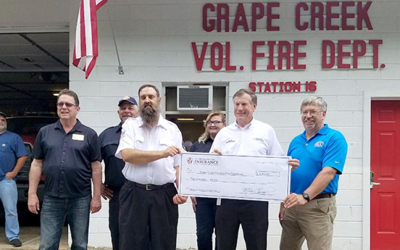 From left are state Rep. Kevin Corbin, Alan Andrews, Grape Creek Fire Chief Joe Lanphere, Rachel Lay, Commissioner Mike Causey and N.C. Firefighter Association financial director Dean Coward. Photo by Samantha Sinclair