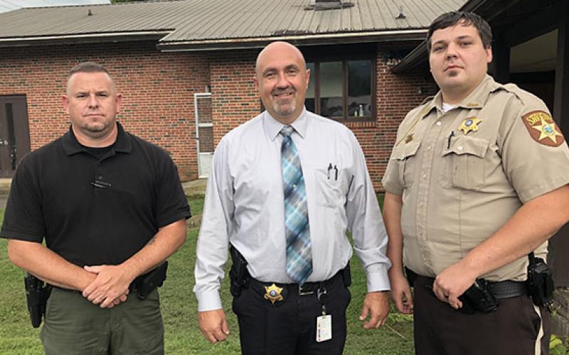 From left are Andrews police Officer Joseph Jones, Cherokee County Sheriff Derrick Palmer and Deputy Patrol Officer Coyle Olsen.