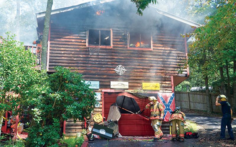 A fire destroyed a garage in the Tanglewood Forest housing development. Officials say a welding accident caused the blaze. Penny Ray/pennyray@cherokeescout.com
