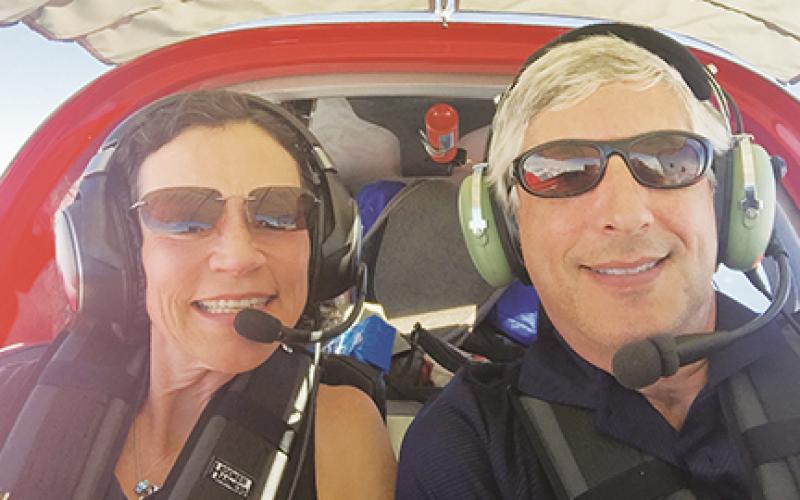 Anne Daley and Adam Molny flying in one of their planes. Daley purchased land more than 20 years ago that she recently donated to Cherokee County and will be sold through a sealed bid process.
