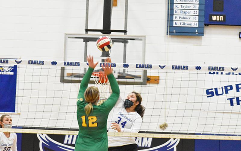  Hiwassee Dam basketball stand-out Katie Gibson rises up for a kill in the third set  of the Lady Eagles’ season opener against Blue Ridge on Monday. 