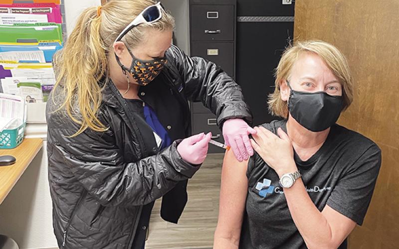 Dr. Mary Lane of the Cherokee County Health Department was one of the first to receive the COVID-19 vaccine in Cherokee County. Nurse Misty Postell is administering the vaccine.
