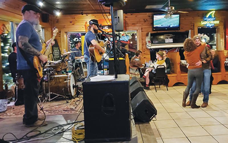 Photos by Samantha Sinclair/scoutingaround@cherokeescout.com The Andrew Chastain Band performs at Chevelles Restaurant & Bar in Murphy.