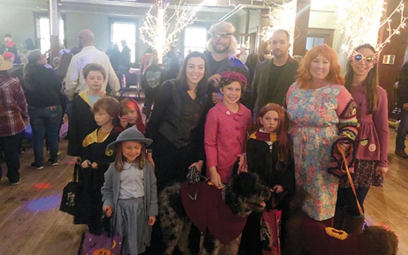 A family dresses as the entire cast of Harry Potter: Mrs. Umbrage-Rowan Woods, Flor-Reese Gray Woods, Mad Moody-Chris Woods, Luna- Ashley McCurtney, ,Remus-Thomas Cornett, Bellatrix-Rebecca Cornett, Harry Potter-Eli Cornett, Ron Weasley-Bailey Cornett, the Weasley twin Titus and Tucker Cornett, Mrs. Weasley- Melinda Woods and dogs Chaco and Ollie