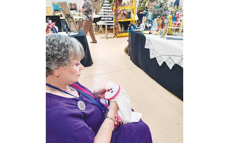 Glynda Kendall enjoys doing her embroidery at arts and craft shows. There are many reasons why local artists decide to become vendors and sell their homemade products to the public.