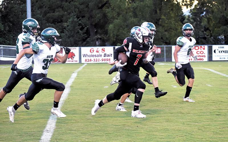 Andrews Isaac Weaver runs by the East Henderson defense during the Wildcats’ 46-14 home win Friday night.