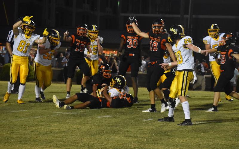 Justin Fitzgerald/sports@cherokeescout.com Murphy’s Will Johnson (81) and John Ledford (20) signal for a first down after Wyatt Simmons (on ground) recovered a blocked Bulldogs punt.
