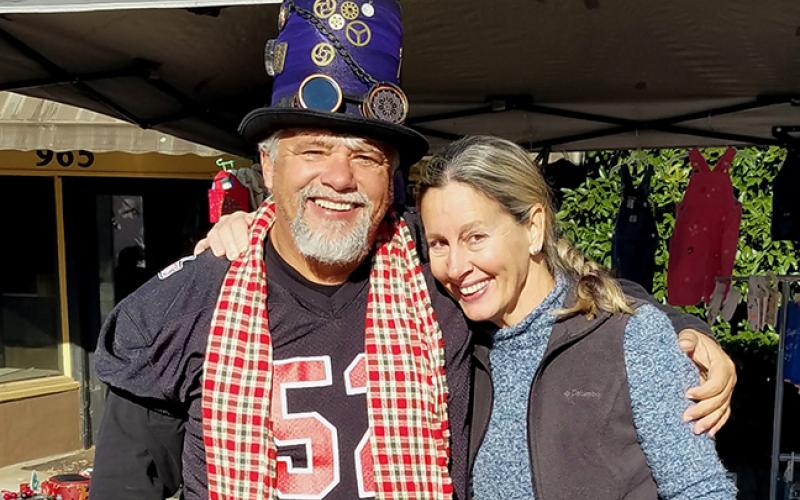 Andrews Mayor James Reid poses with Cherokee Scout Staff Correspondent Anngee Quinones-Belian, showing off his new purchase of a steampunk hat.