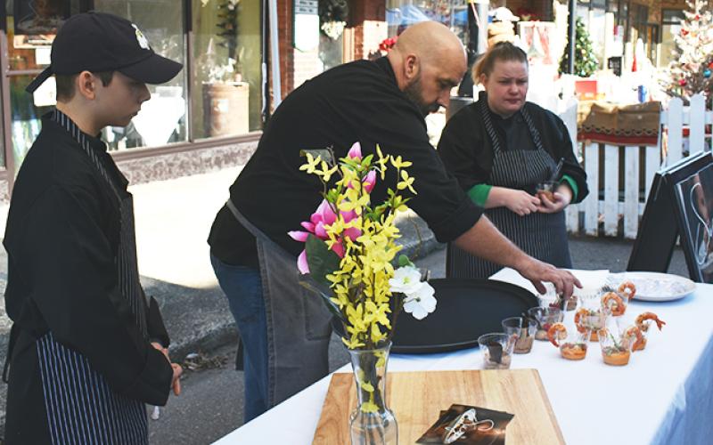 Steven Lash with Sage Restaurant serves up treats for festival-goers Saturday afternoon.