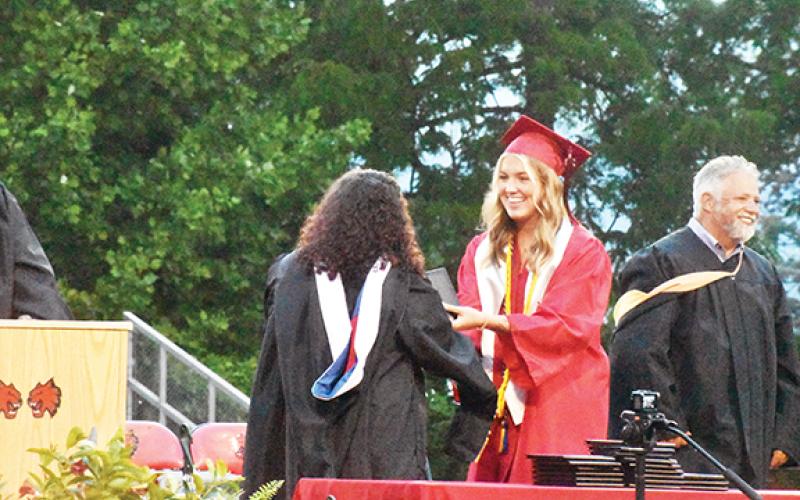 Justin Fitzgerald/sports@cherokeescout.com Andrews senior Rylie McDonald was all smiles upon receiving her diploma on June 1.