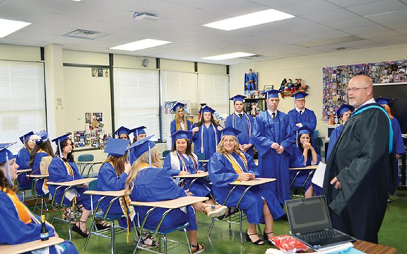Abigail Blythe Batton/Staff Correspondent Principal Daniel McNabb speaks with the graduates before their commencement at Hiwassee Dam High School’s Class of 2023 graduation on June 3. 