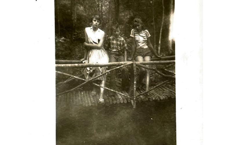 This photo was taken in around 1958 at the Cover Falls, which used to have a beautiful “foot-log” bridge across the creek made out of sapling logs. It was not taken care of and eventually rotted and washed away. Shown from left are Gaynell Birchfield, Jimmy Wayne Birchfield and Peggy Rae Pugh.  