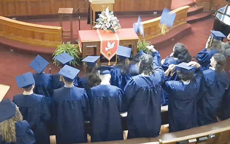 The Oaks Academy Class of 2023 sat among a packed audience at the Murphy First United Methodist Church as graduating students receive their diplomas.