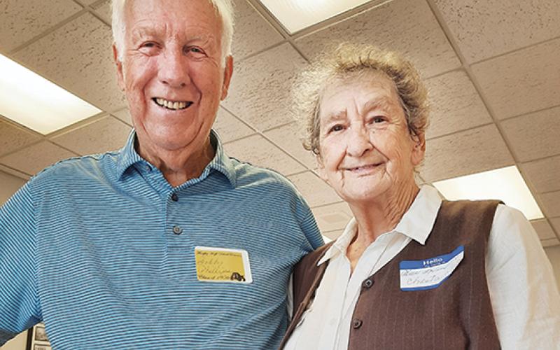 Bobby Phillips and Alice Lovingood Chastain share laughter and a photo during the Murphy High School reunion for the Class of 1956.