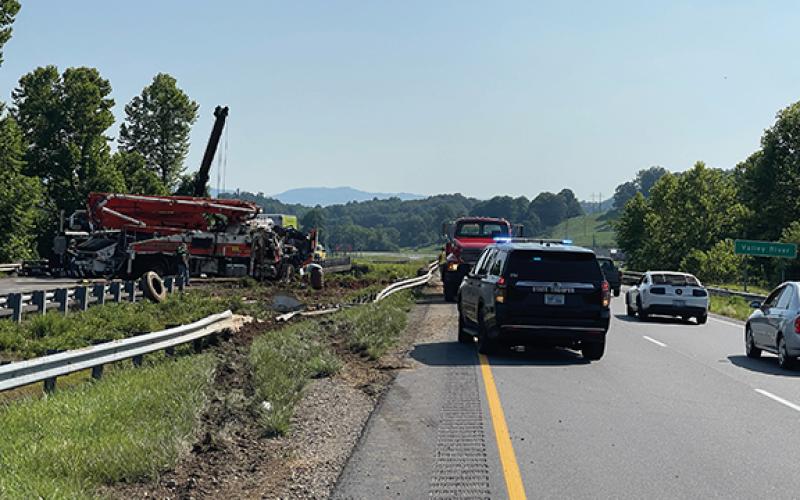 Randy Foster/editor@cherokeescout.com The wheel tracks are in the foreground where a concrete pumper truck left the roadway and crashed through a guard rail and rolled over early Monday morning.