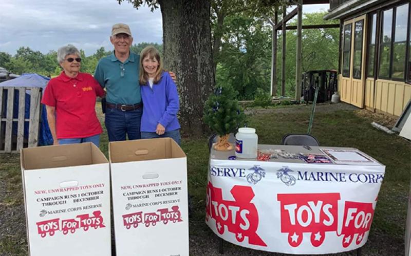 Sarah Thomas/Contributing Photographer Toys for Tots volunteers Gwen Hathaway, Don and Pattie Reynolds enjoy the fundraiser at the Nottely River Valley Vineyards on June 24