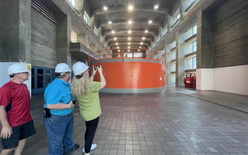 Civilians take pictures of electric generators during a tour of Fontana Dam on July 28. 