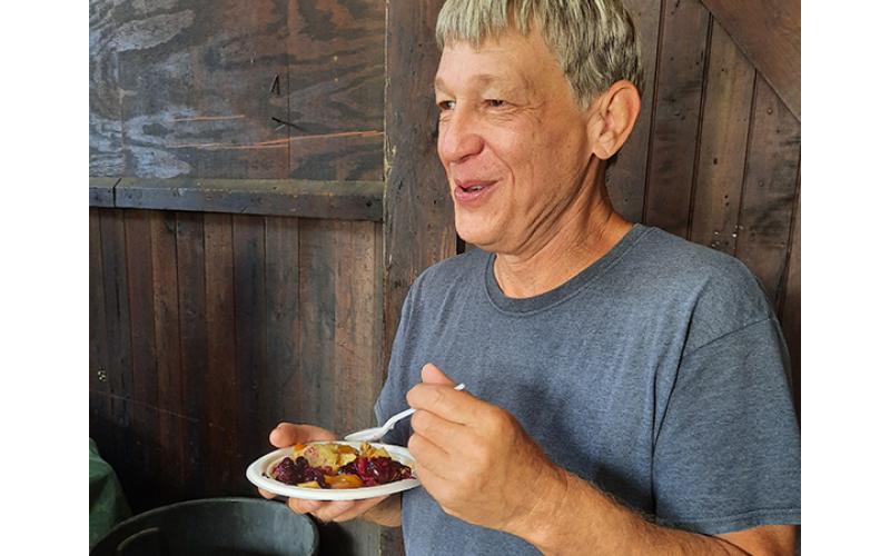 Tim Reeves of Carrollton, Ga., stopped by the Murphy Farmers Market at the L&N Depot for Fun with Fruit Day on Aug. 19. He had no trouble sampling each of the pies on display, enjoying them all. He ended up choosing the ginger-pear pie as his favorite. 